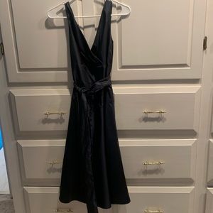 Just  below the knee dress. Slight shimmer.  Dark navy blue